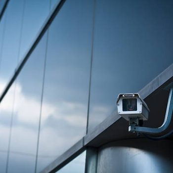 A security camera on the exterior of a building.